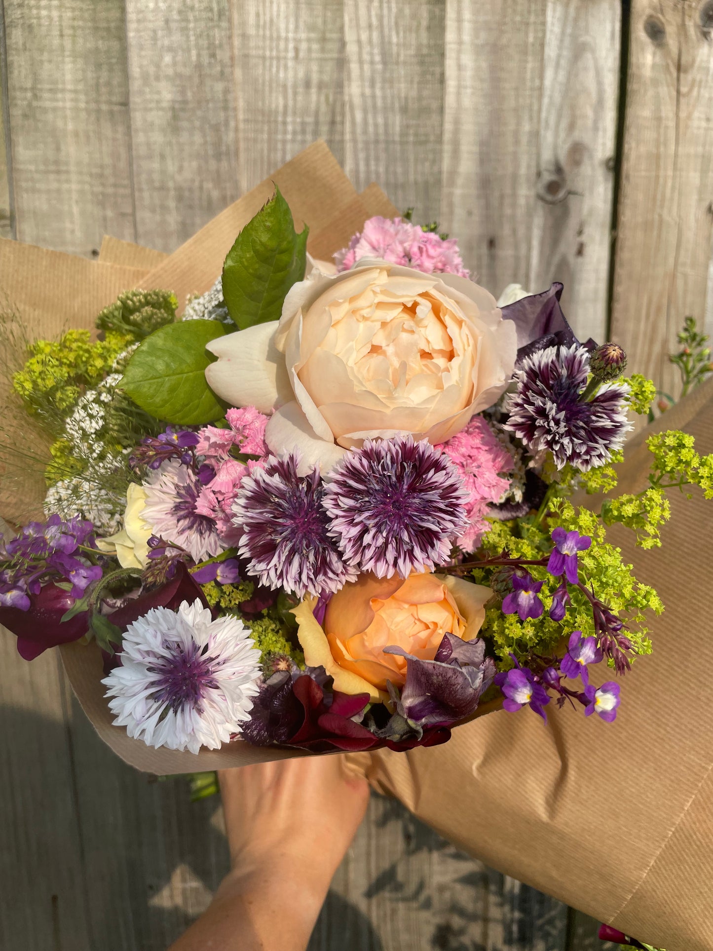 Bouquet including roses and cornflowers